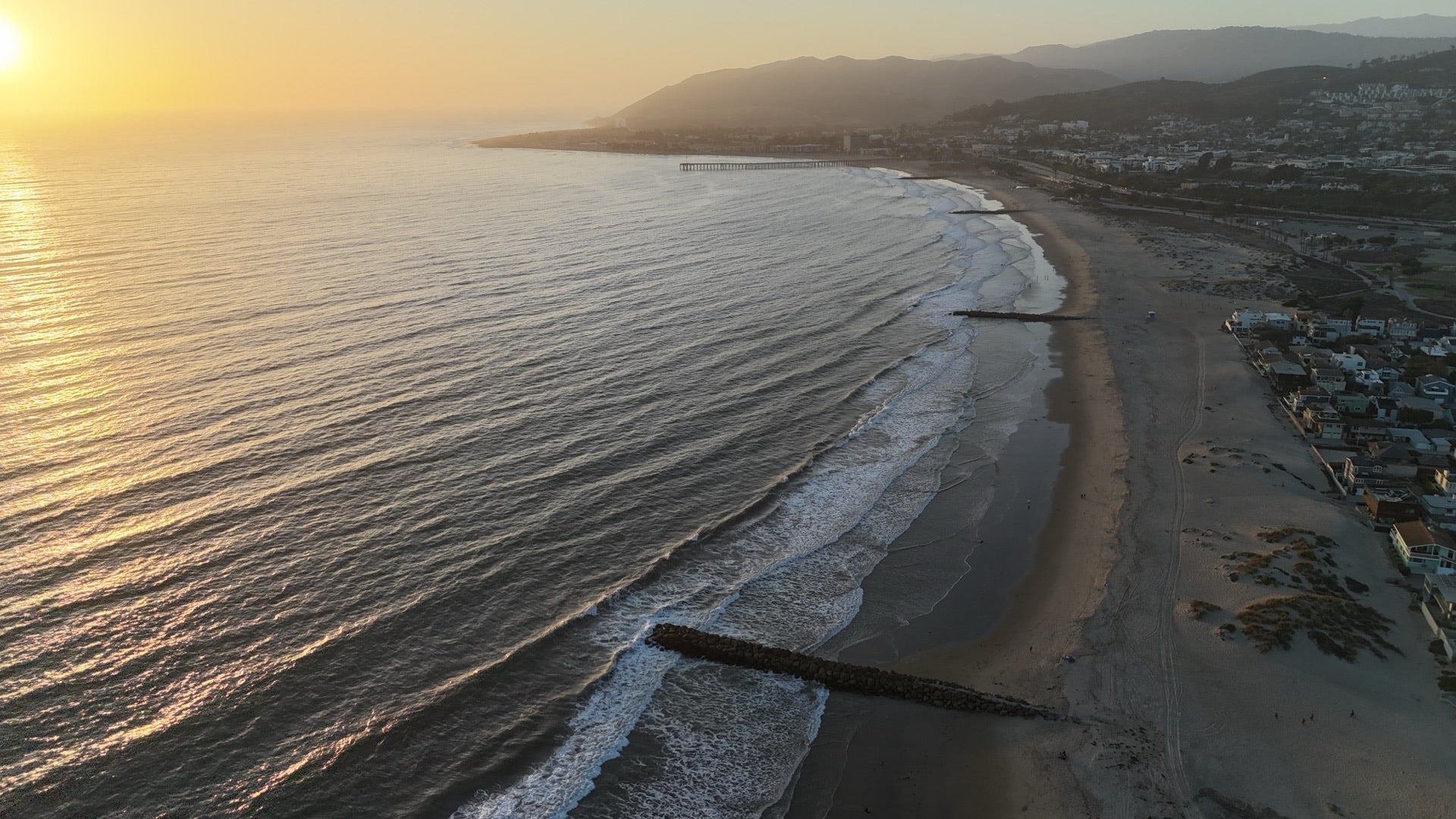 Pacific coastline viewed from above at golden hour