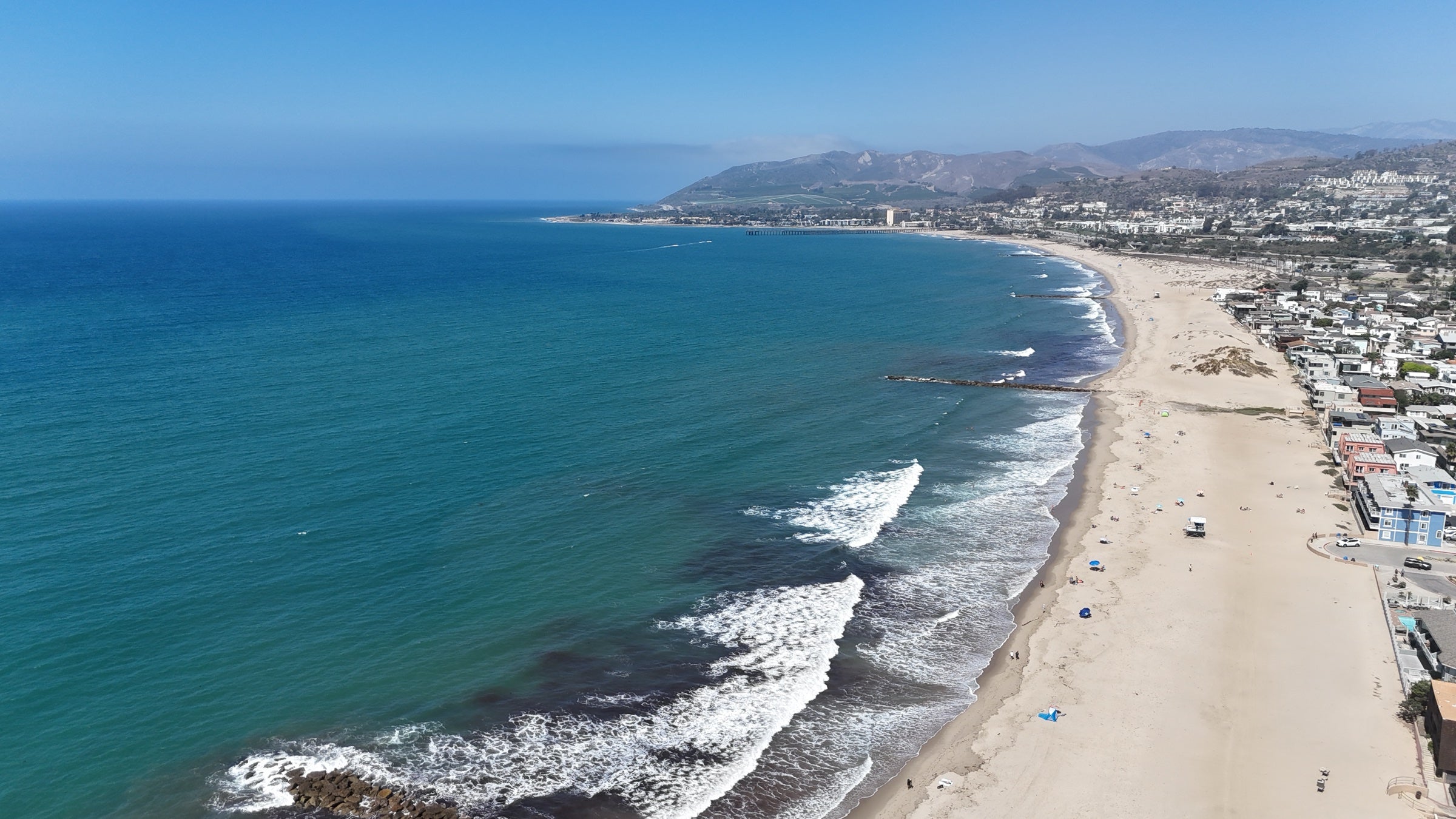 Aerial view of the Pacific coast and a broad Southern California beach